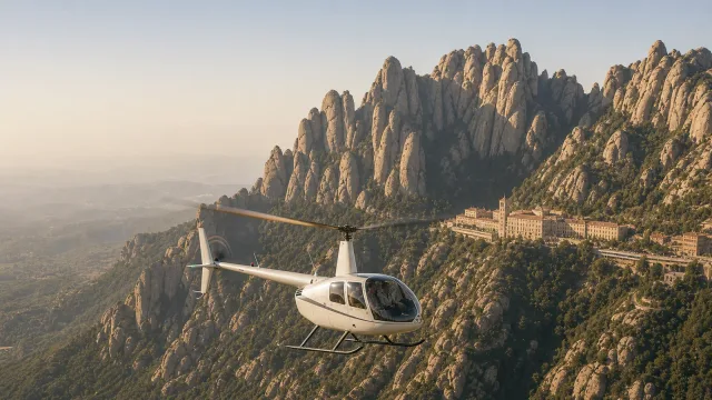 Helicopter flying past Montserrat's jagged mountain peaks with the monastery below